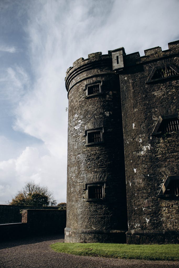 A striking view of the ancient Cork City Gaol tower in Ireland, showcasing its historical architecture.