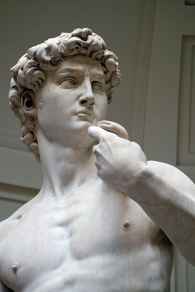 Close-up view of Michelangelo's David statue in Florence, capturing its exquisite marble detail.