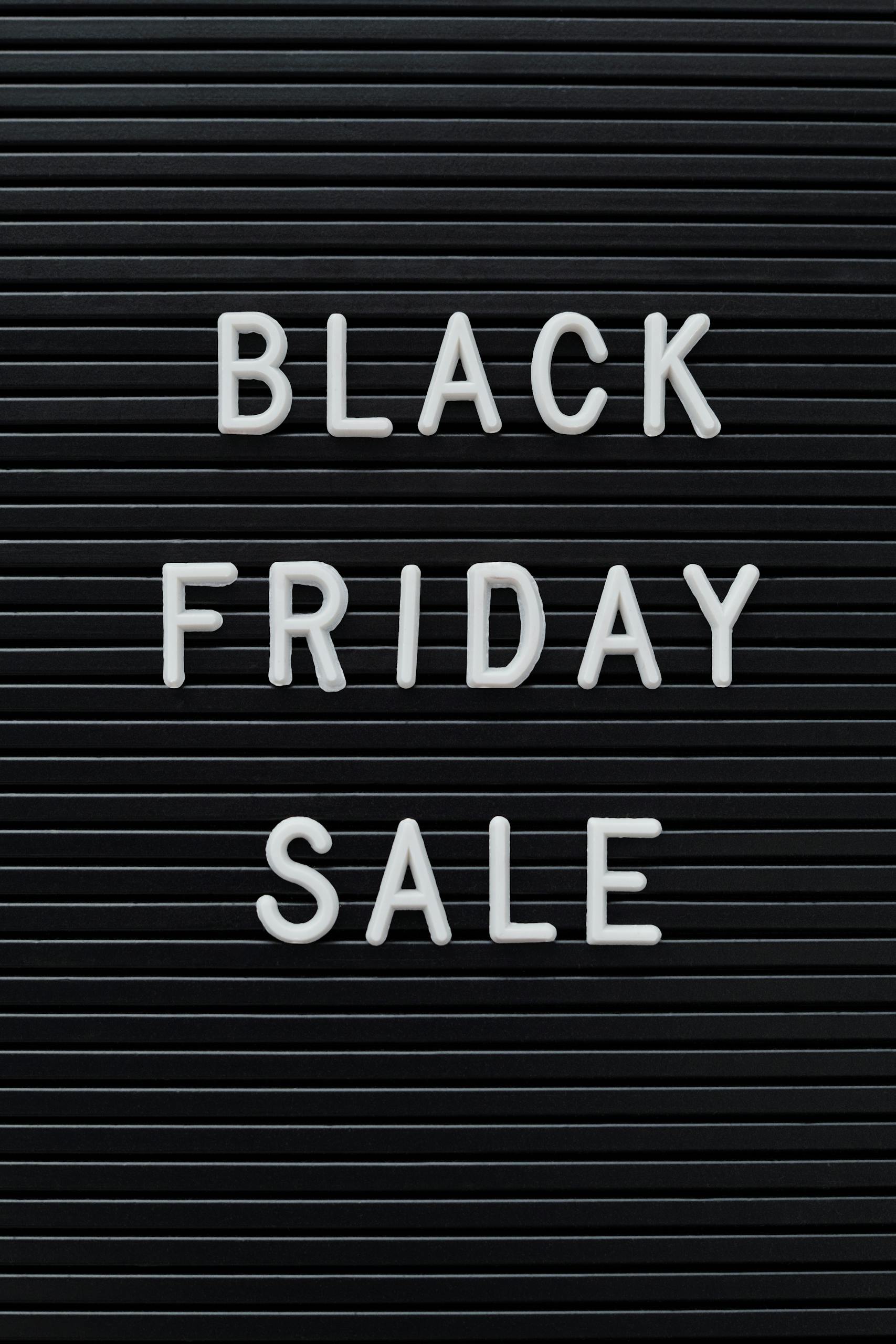 Simple black sign with 'Black Friday Sale' text, perfect for consumerism and discount themes.