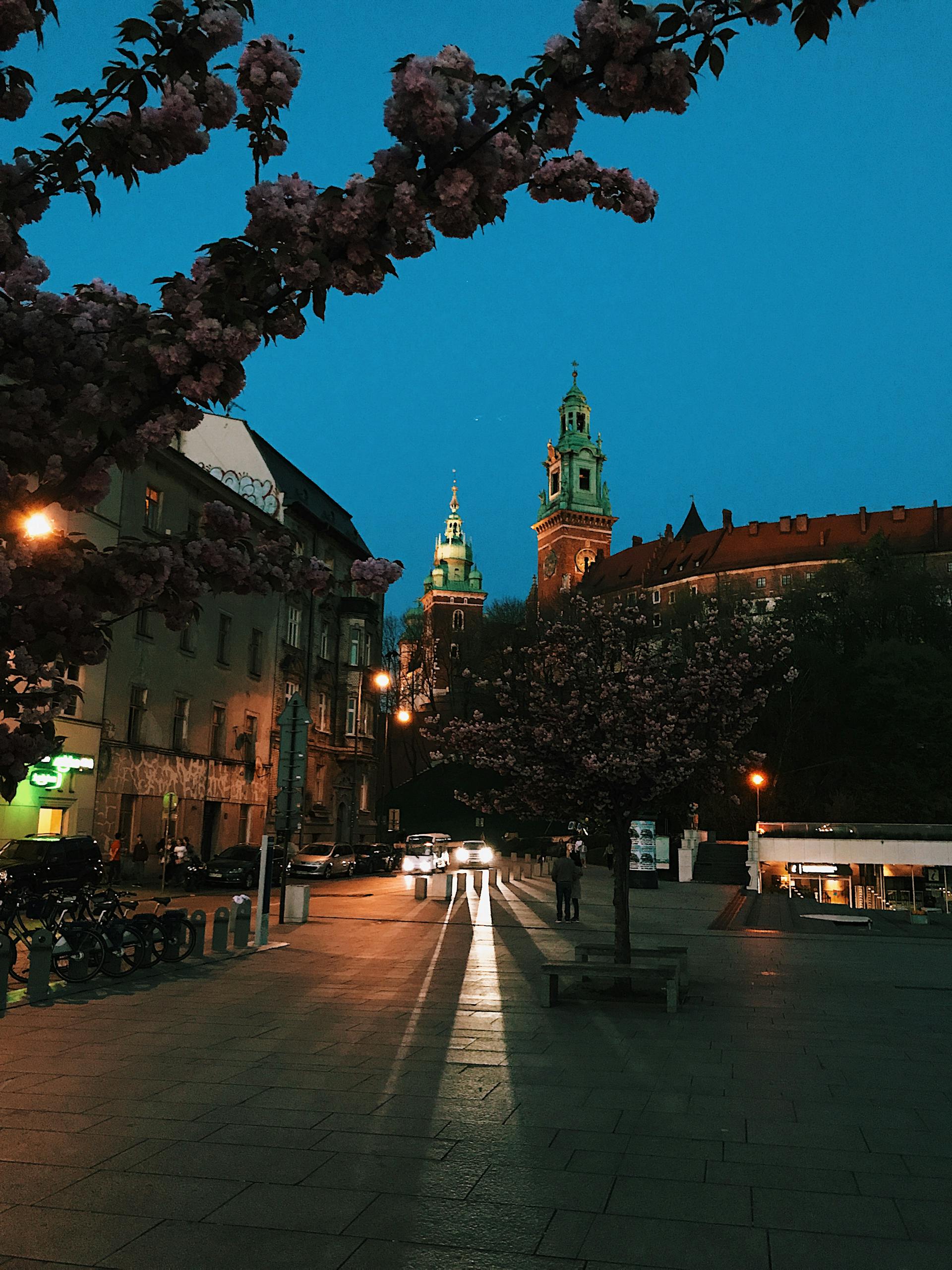 Vibrant view of St. Mary's Basilica in Krakow's bustling main square.