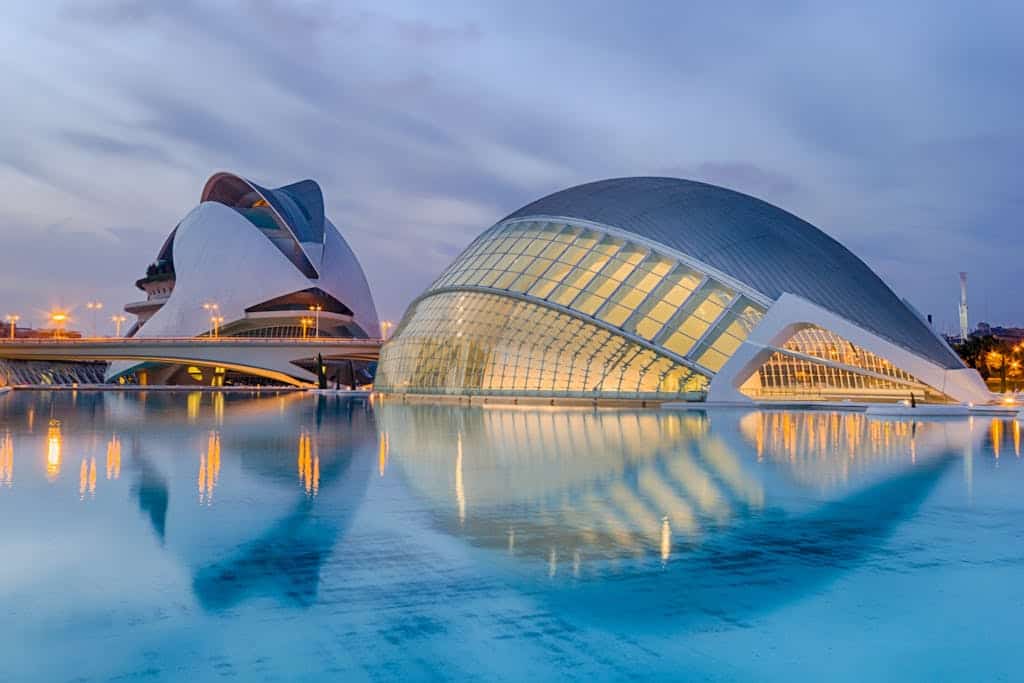 A breathtaking view of Valencia's City of Arts and Sciences reflected in serene waters at twilight.