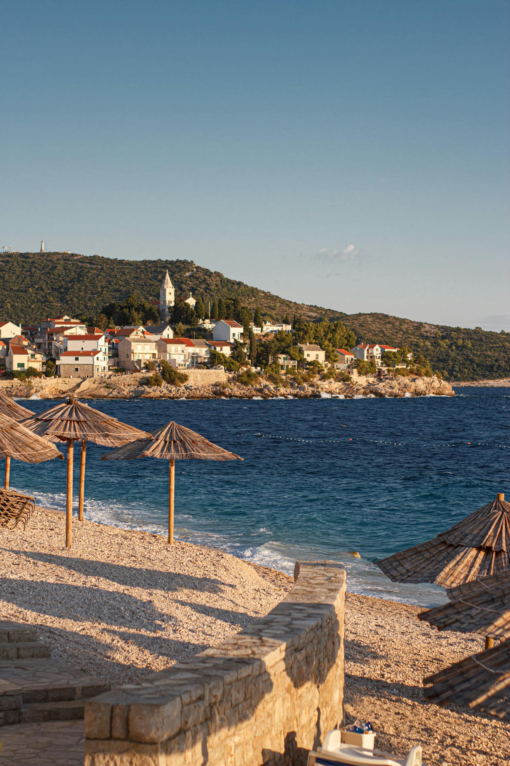 Beautiful summer day at Primošten beach with scenic views of the Adriatic coastline.