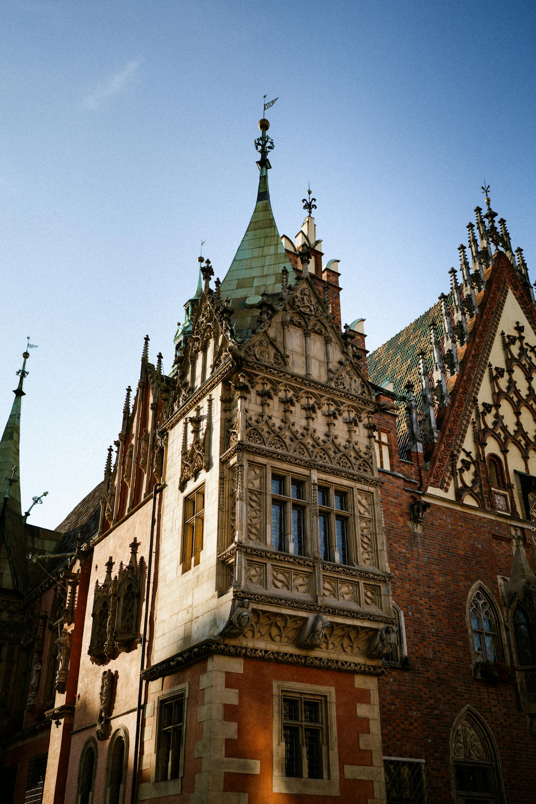 Ornate Gothic building facade in Wroclaw, Poland showcasing historic architectural detail.