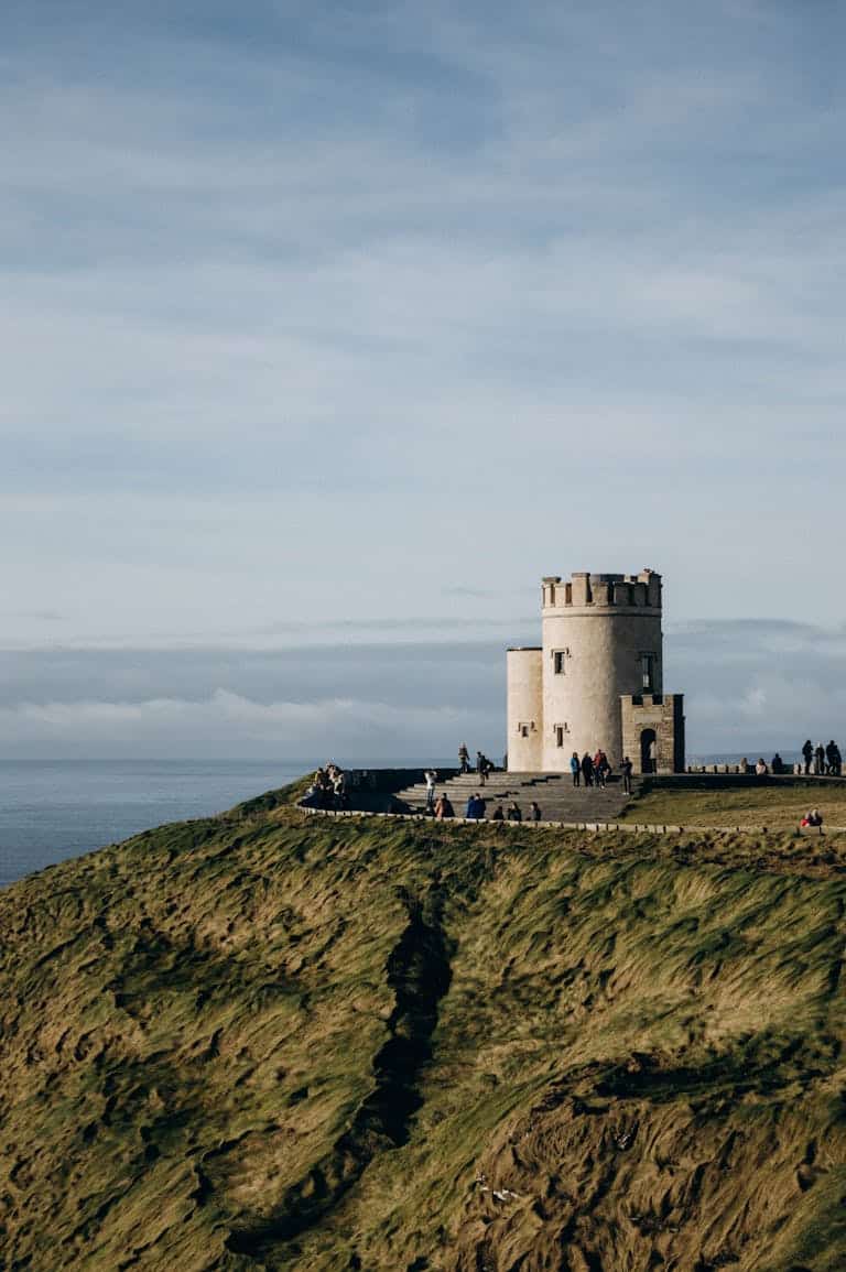 O'Brien's Tower atop the Cliffs of Moher with a scenic ocean view, showcasing historical architecture.