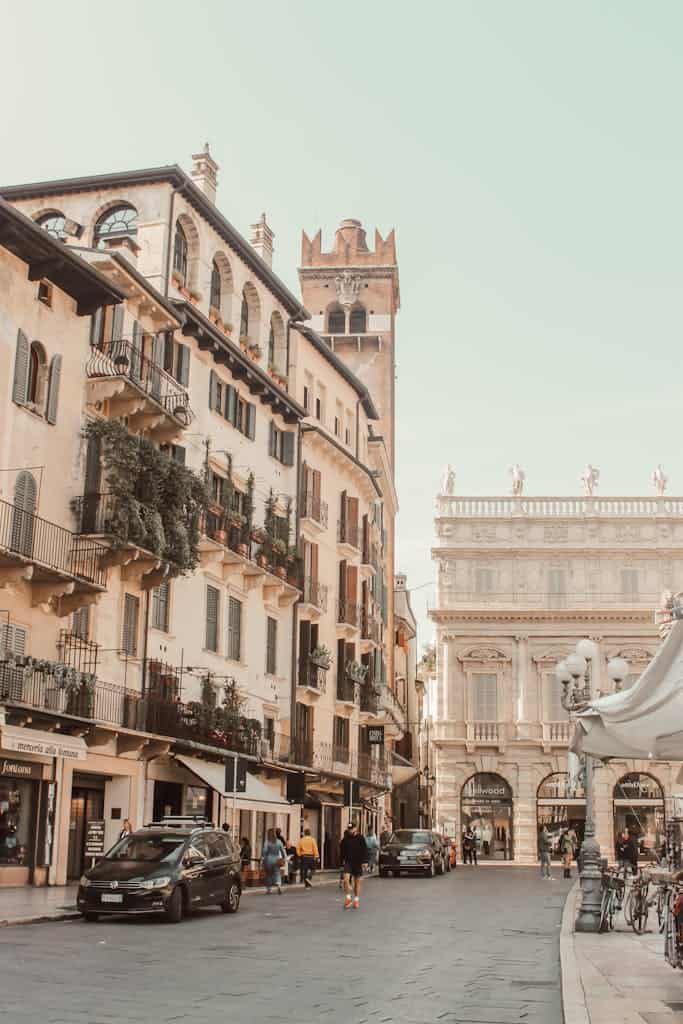 Explore the historic charm of Verona's Piazza delle Erbe with classic architecture and lively atmosphere.