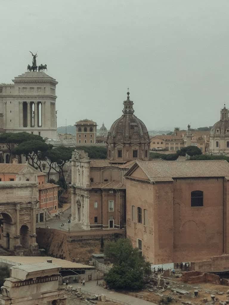 Historic view of Roman architecture featuring iconic landmarks and ancient structures in Rome, Italy.