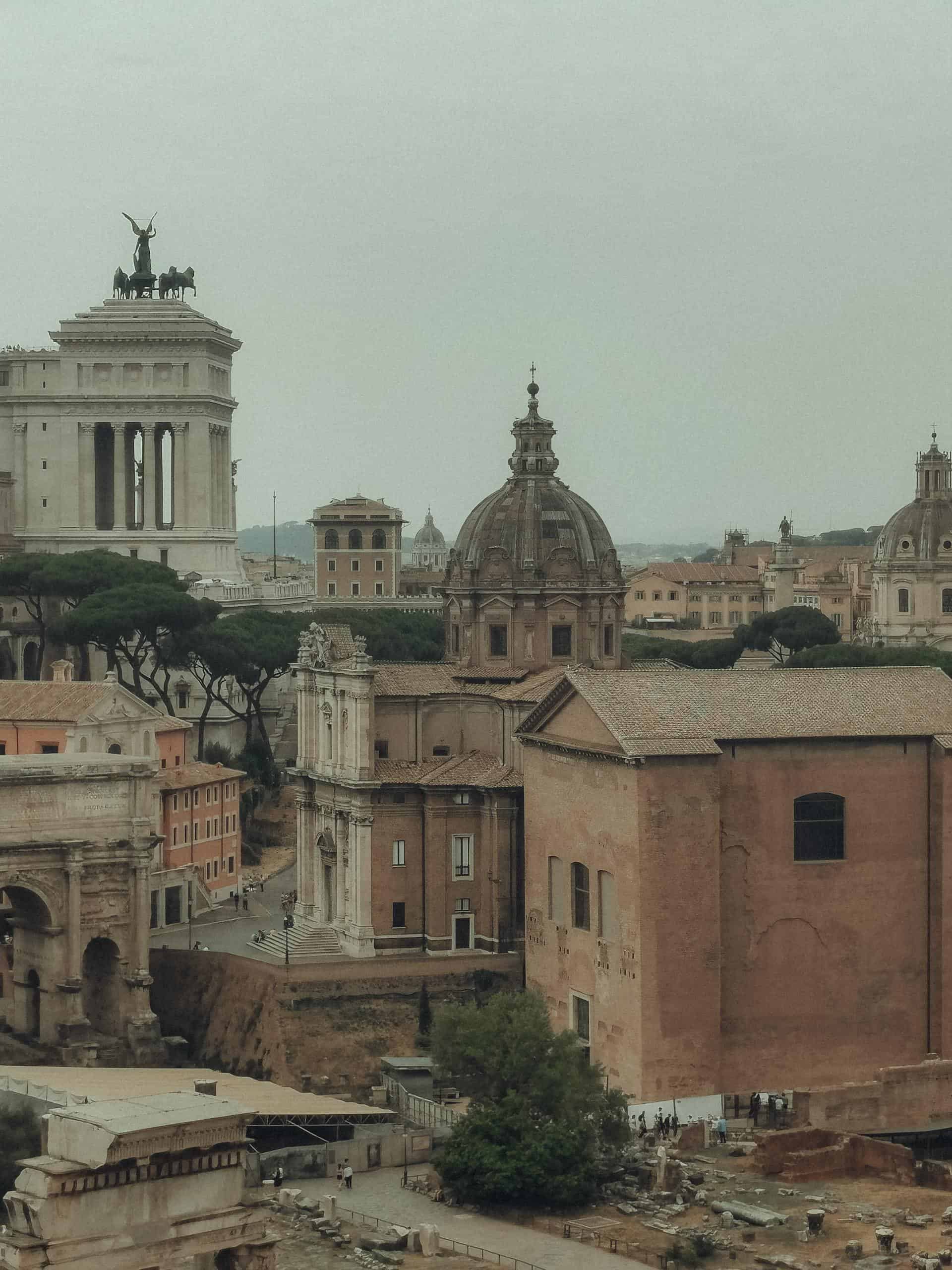 Historic view of Roman architecture featuring iconic landmarks and ancient structures in Rome, Italy.