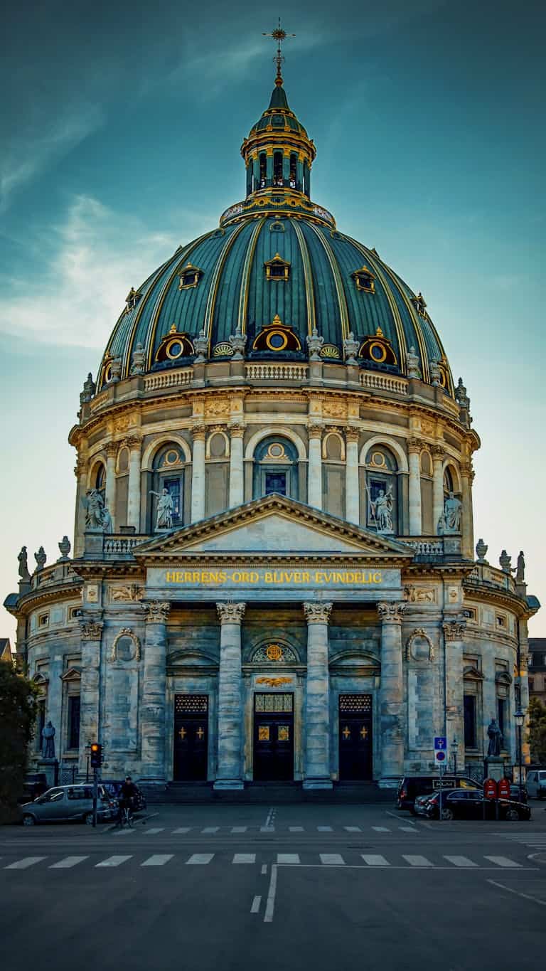 Stunning view of Frederik's Church, a Rococo architectural masterpiece, in Copenhagen at dusk.