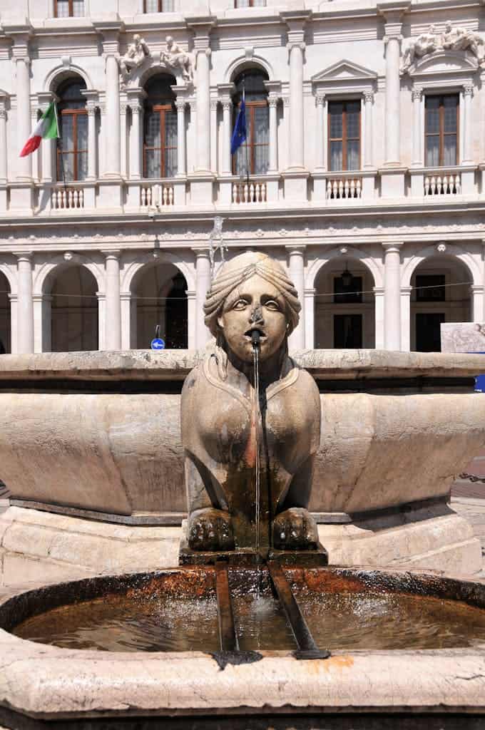 Beautiful fountain sculpture in front of historic building in Bergamo Alta, Lombardia, Italy.