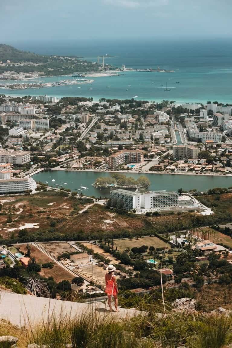 Breathtaking aerial view of Alcudia, Spain's coastal cityscape with sea and urban landscape.