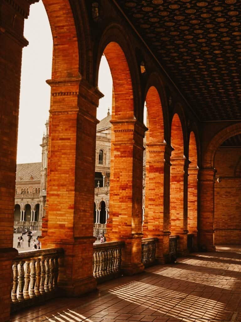 The beautiful archways lining the Plaza de Espana in Seville, Spain