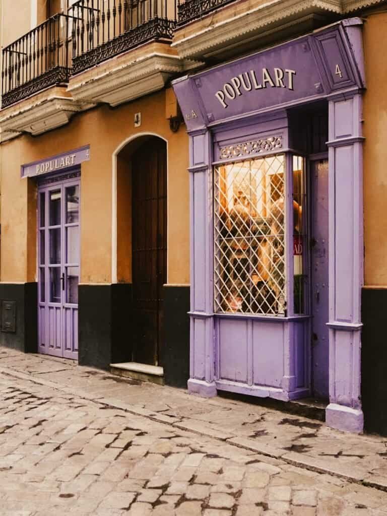 A colourful shop front in the popular neighbourhood of Barrio Santa Cruz in Seville. A great place to include in a 1 day Seville itinerary